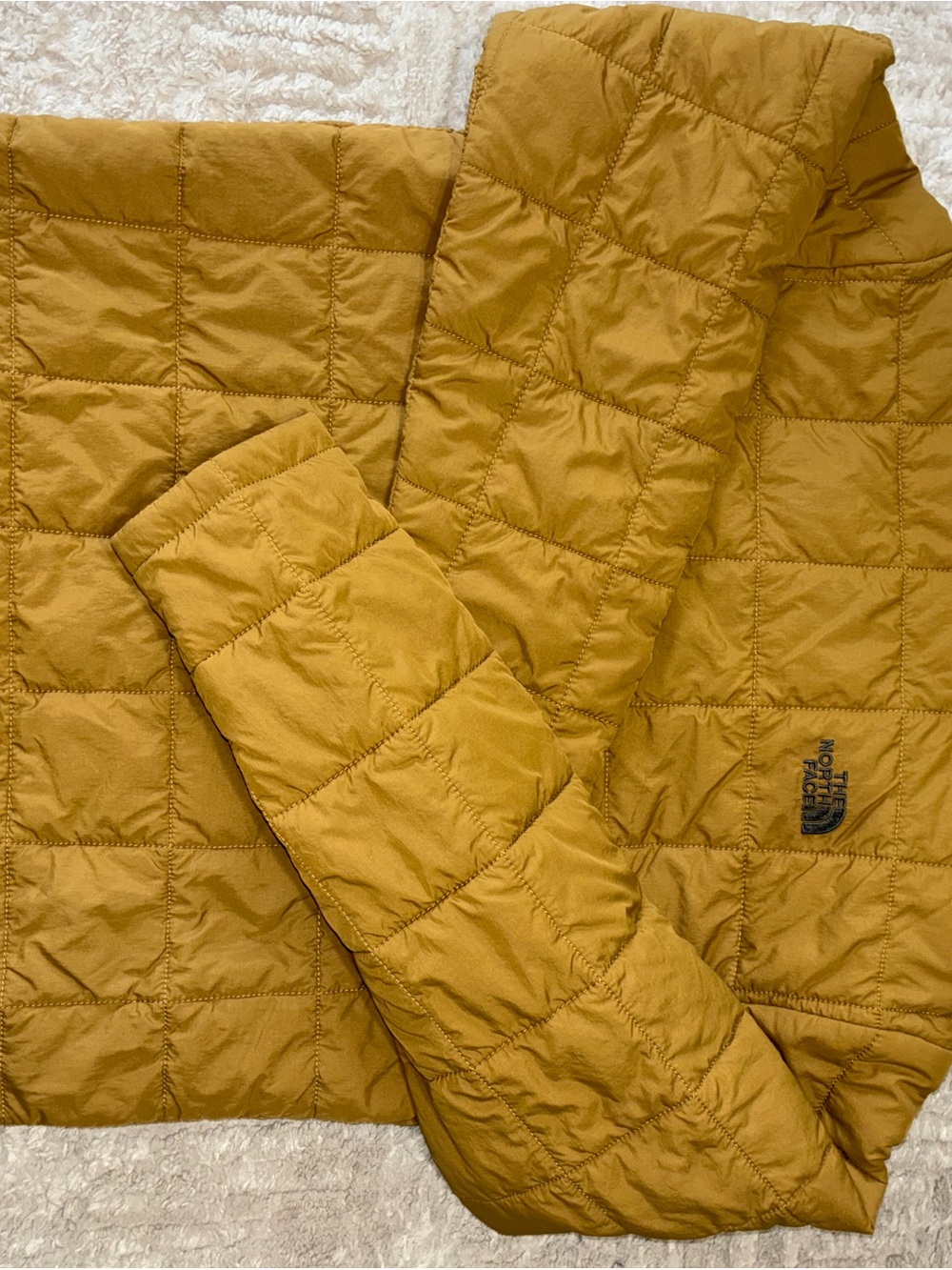 The North Face Boys Quilted Puffer Jacket in Mustard Yellow